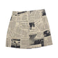 Tan mini skirt newspaper